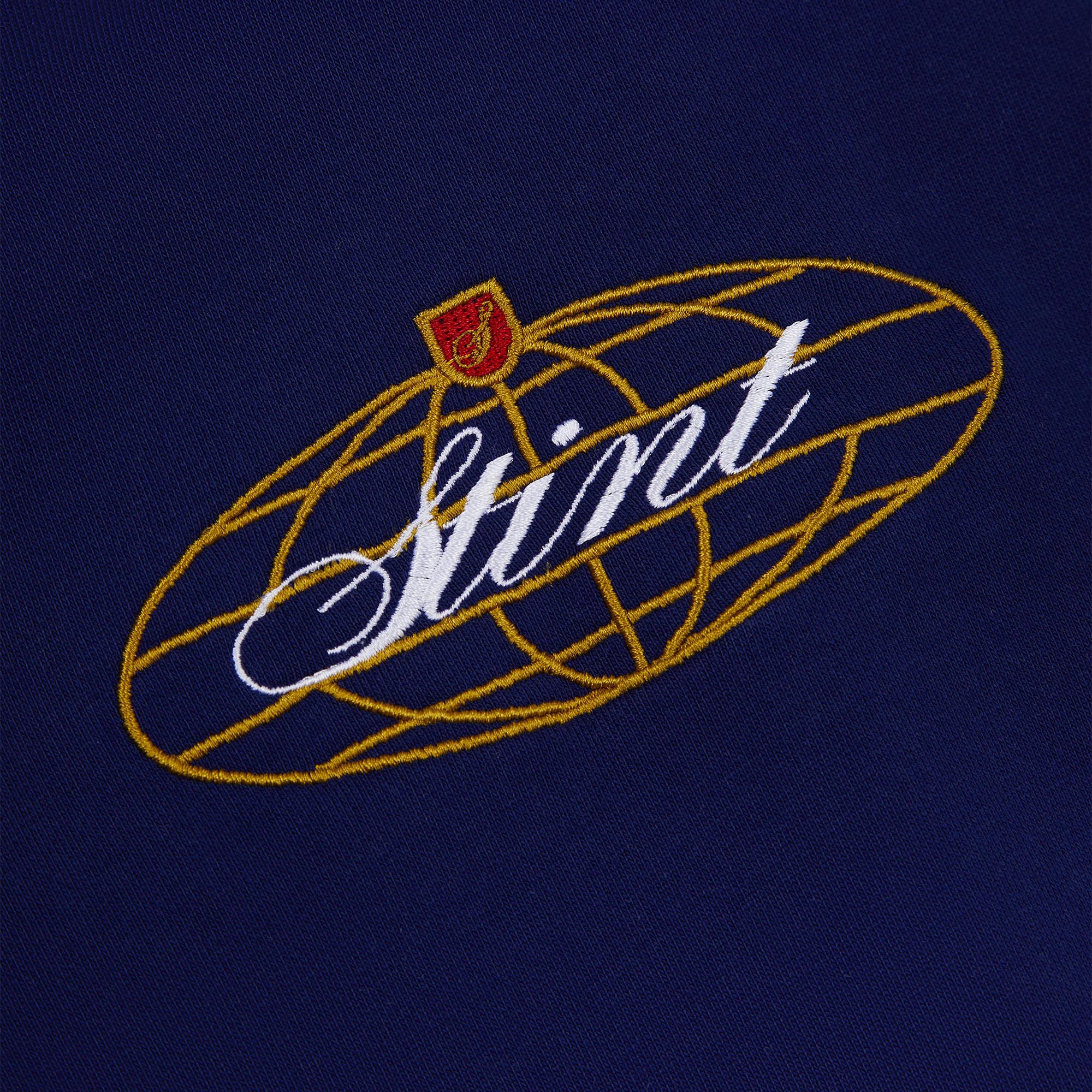 962 Hoodie by STINT GEAR. Close detail of the embroidered chest mark on navy. Motorsport livery apparel.