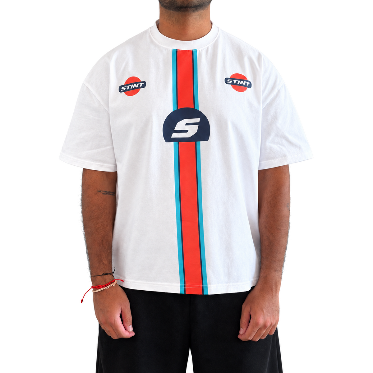 Marigold Tee by STINT GEAR worn front view. Marigold band on white. Model wears size L.