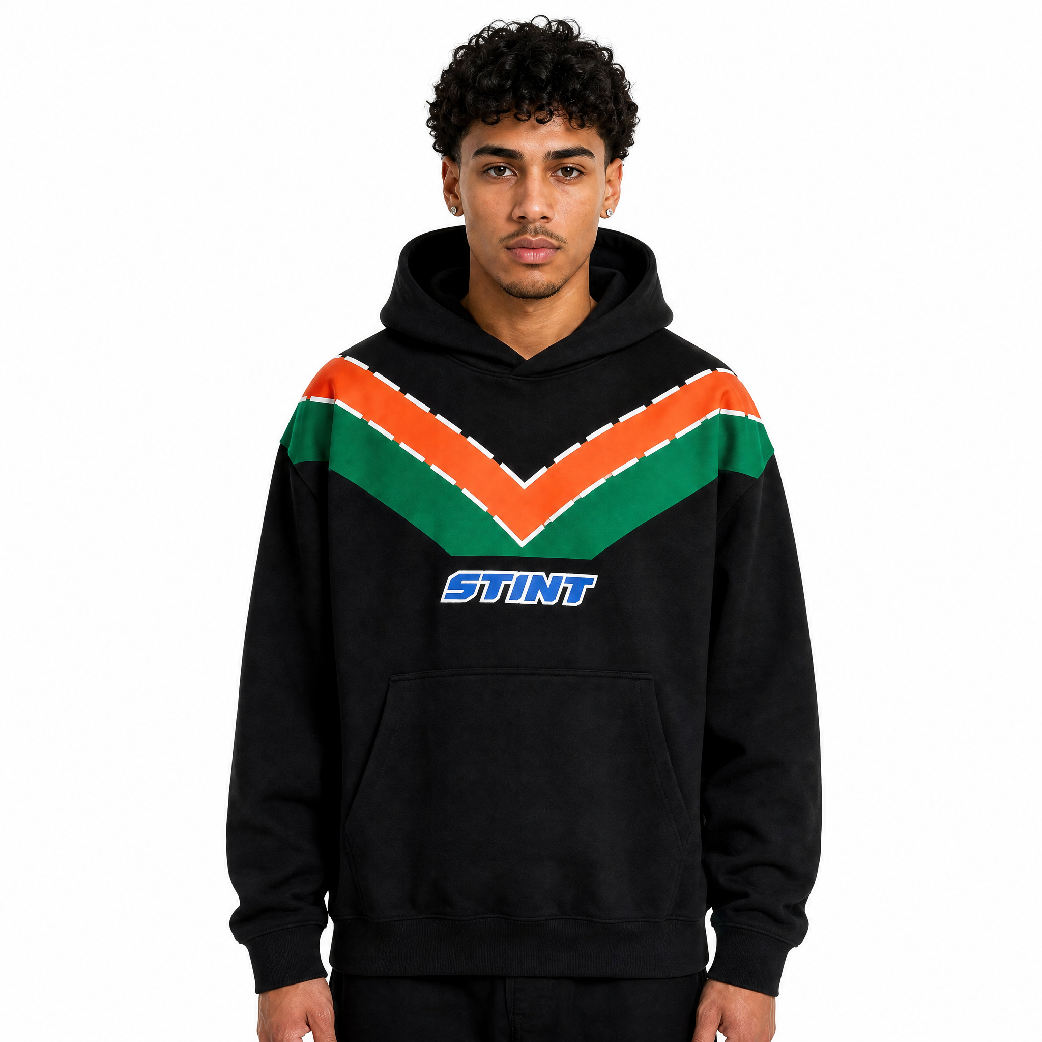 Rotary Hoodie by STINT GEAR. Orange and green 787B livery on black, worn front view. Motorsport livery apparel.