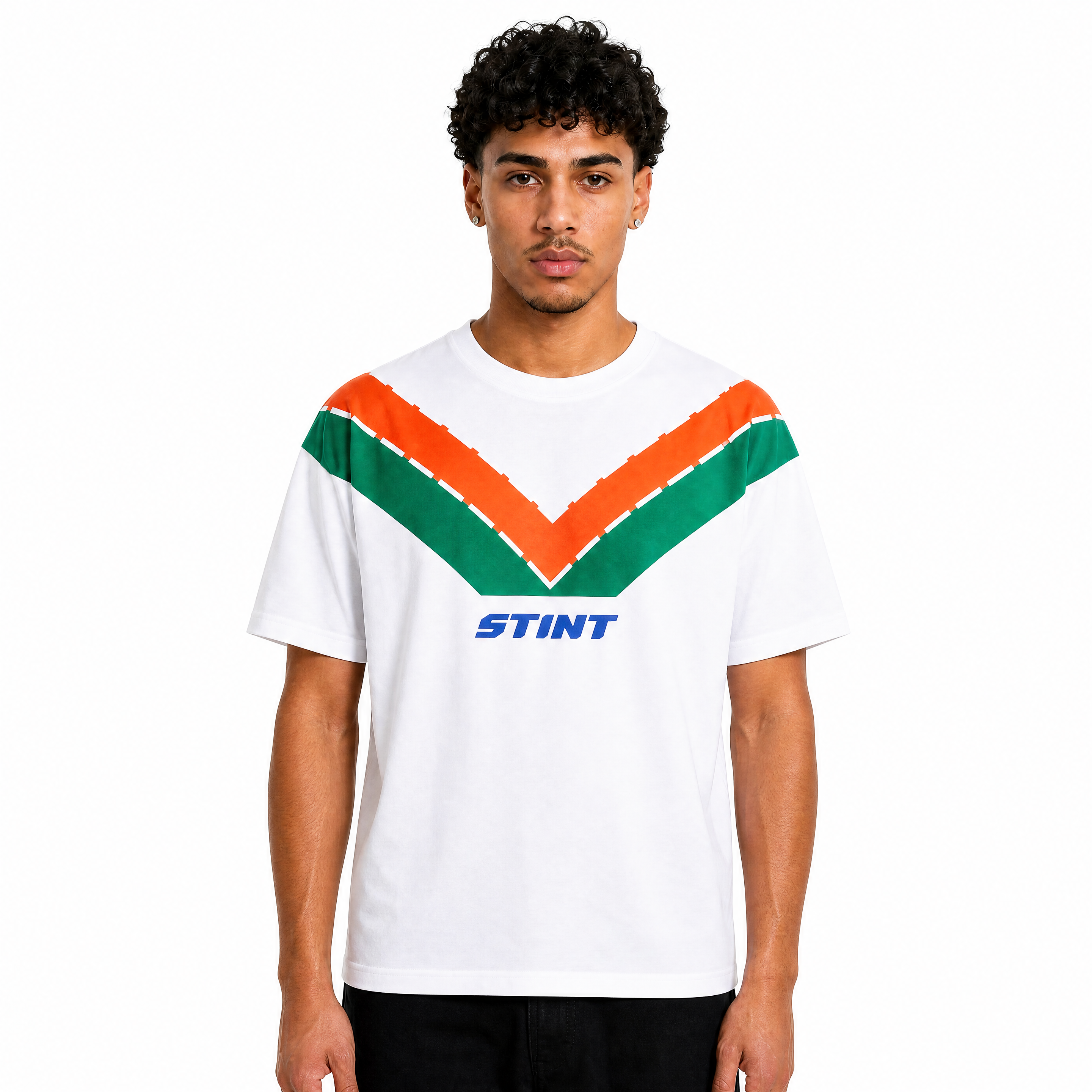 Rotary Tee by STINT GEAR. Orange and green 787B livery on white, worn front view. Motorsport livery apparel.